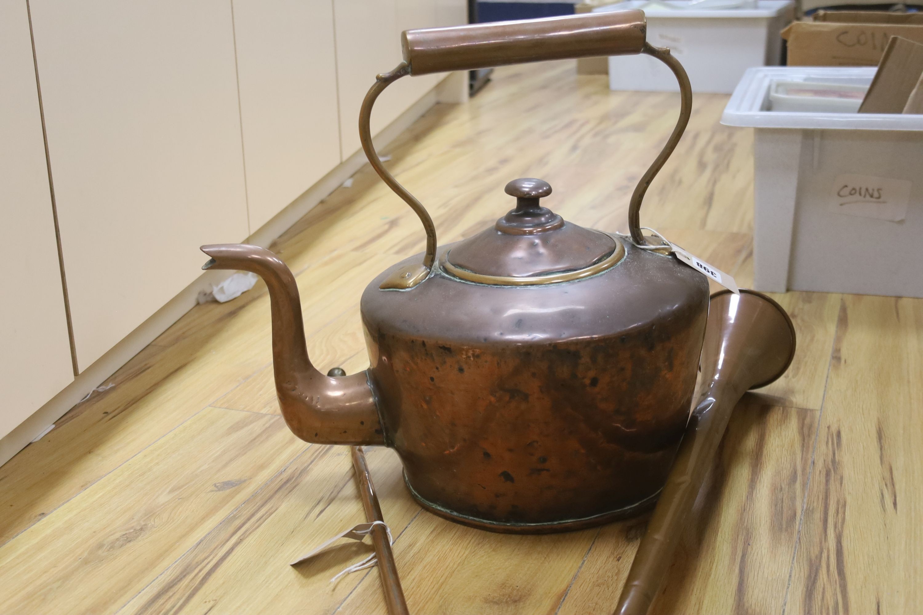 A large Victorian copper kettle with cover, 43cm including handle, and two copper hunting horns